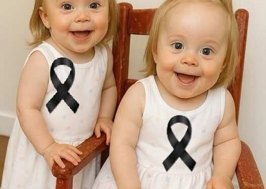 Young woman puts both babies inside the fir…