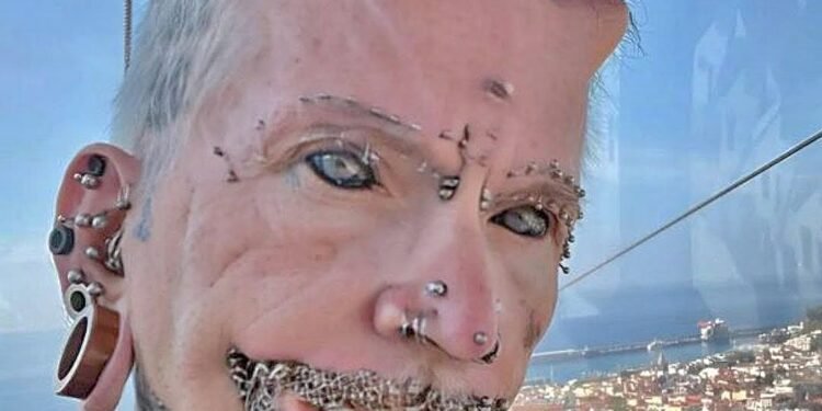 A man with 560 piercings, countless tattoos, and forehead implants – this is how he looked before